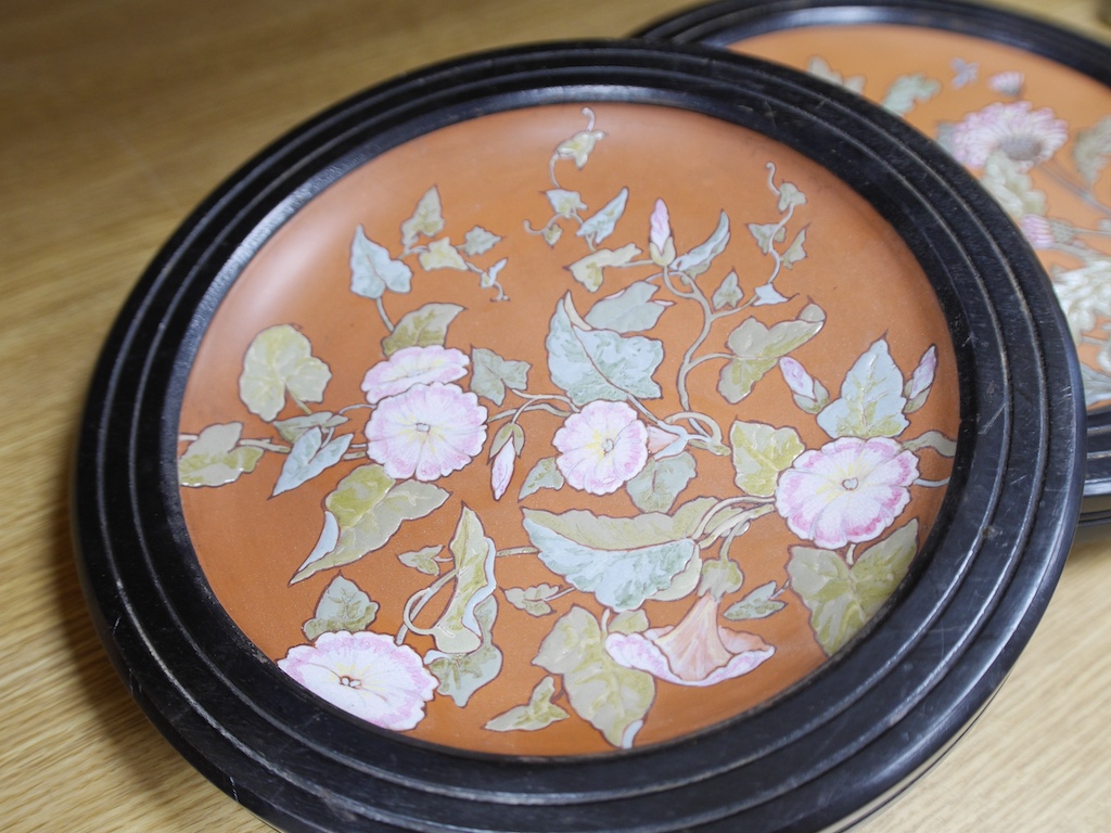 A pair of framed Victorian Aesthetic period terracotta dishes, possibly Watcombe pottery, 33cm total diameter. Condition - fair to good